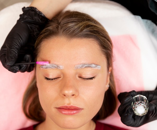 Client receiving powder brows treatment at Monaco Beauty salon
