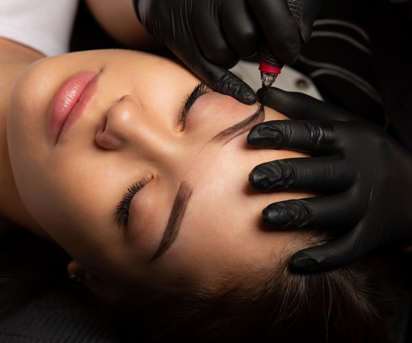 Client undergoing permanent makeup consultation