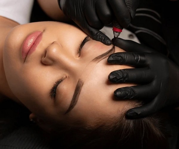 Eyebrow microblading tools on a tray